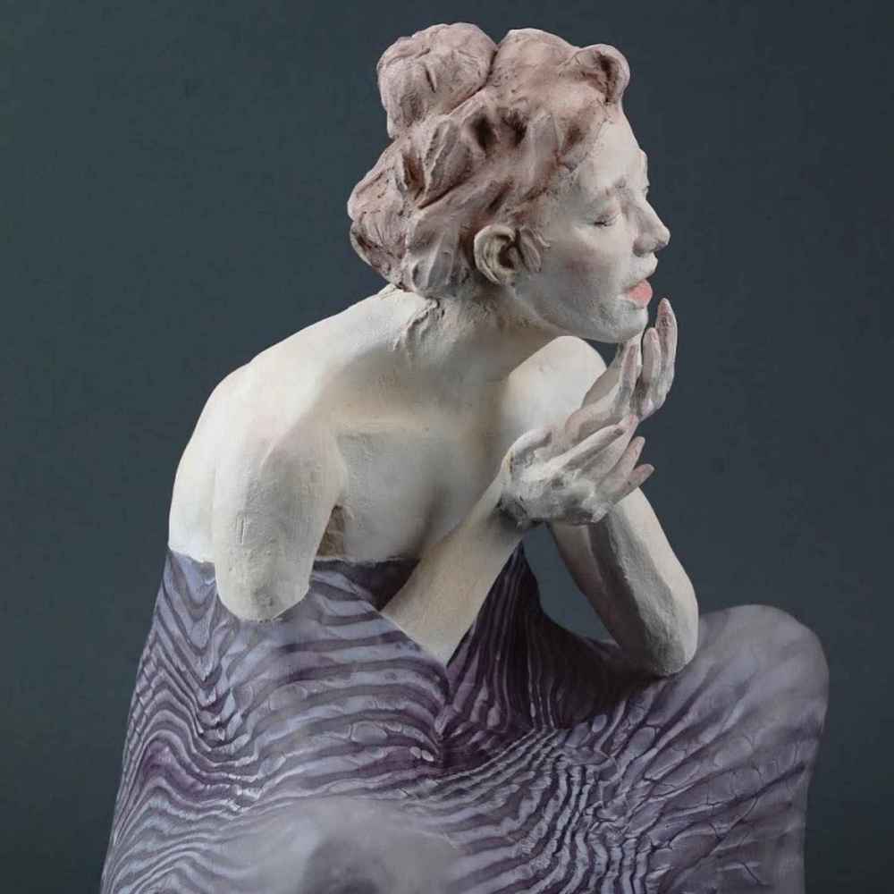 Sculpture of a woman in clay and glass- Emily Lamb